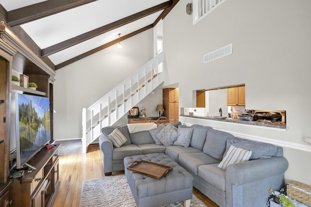 93 Faringdon Dr, Crystal Lake, IL 60014 - living area featuring stairway, high vaulted ceiling, beam ceiling, and light wood finished floors