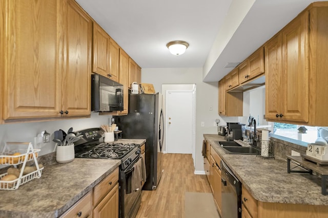 93 Faringdon Dr, Crystal Lake, IL 60014 - kitchen featuring black appliances, light wood-style floors, and brown cabinetry