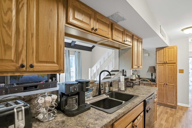 93 Faringdon Dr, Crystal Lake, IL 60014 - kitchen with dishwasher, light wood-style flooring, light stone countertops, and brown cabinetry