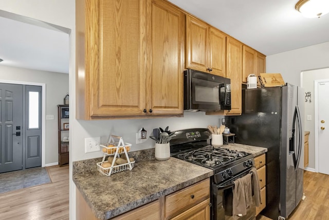 93 Faringdon Dr, Crystal Lake, IL 60014 - kitchen with black appliances and light wood-style flooring