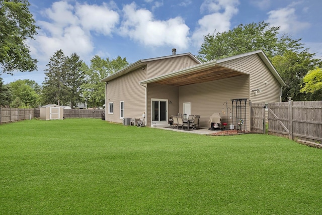 93 Faringdon Dr, Crystal Lake, IL 60014 - back of property with a fenced backyard, a patio area, a storage unit, and a gate