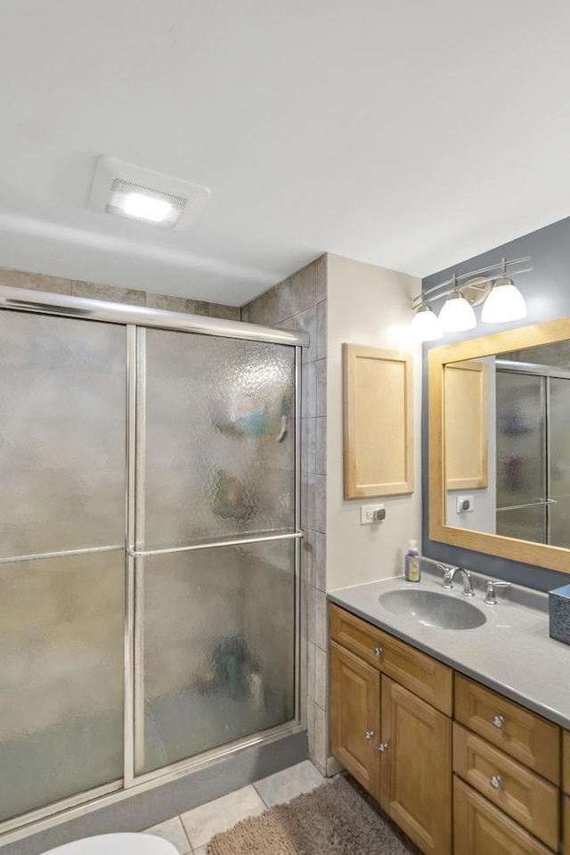 93 Faringdon Dr, Crystal Lake, IL 60014 - full bathroom featuring vanity, a shower with door, and tile patterned flooring