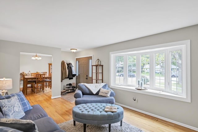 93 Faringdon Dr, Crystal Lake, IL 60014 - living area featuring a chandelier and light wood finished floors