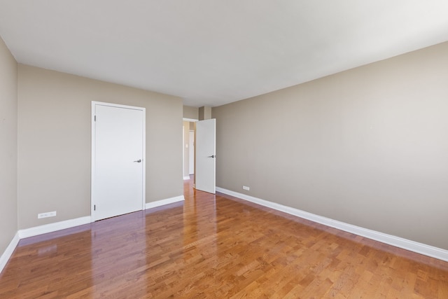 40 N Tower Rd Unit 14B, Oak Brook, IL 60523 - spare room with baseboards and light wood-style flooring