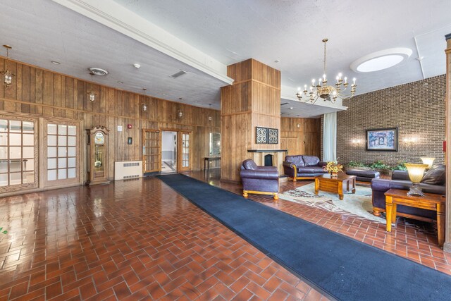 40 N Tower Rd Unit 14B, Oak Brook, IL 60523 - building lobby with wooden walls and a high ceiling