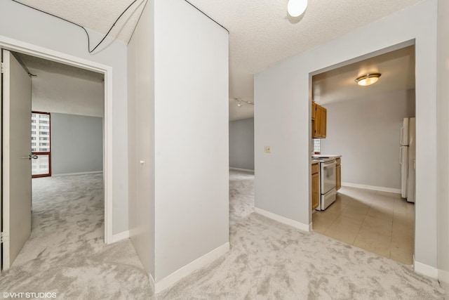 200 N Dearborn St Unit 1803, Chicago, IL 60601 - corridor with light carpet, a textured ceiling, and light tile patterned flooring