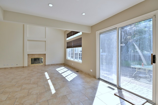 537 Ivory Ln, Bartlett, IL 60103 - unfurnished living room featuring recessed lighting, light tile patterned floors, and a tile fireplace