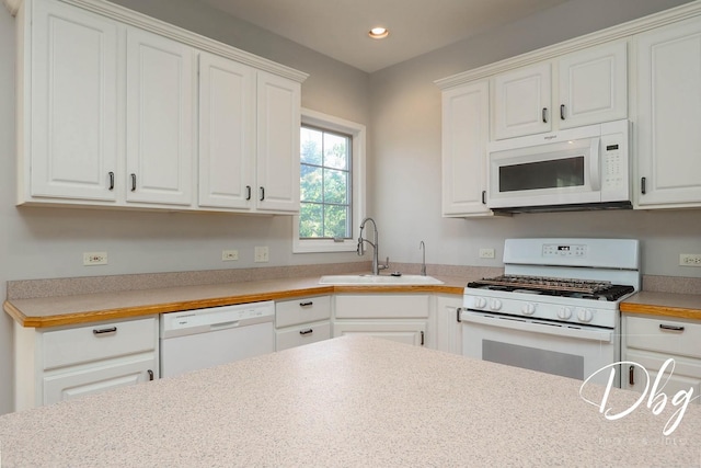 582 Aspen Way, Antioch, IL 60002 - kitchen with white appliances, white cabinetry, light countertops, and recessed lighting