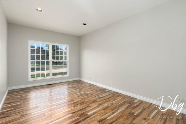 582 Aspen Way, Antioch, IL 60002 - spare room featuring wood finished floors and recessed lighting