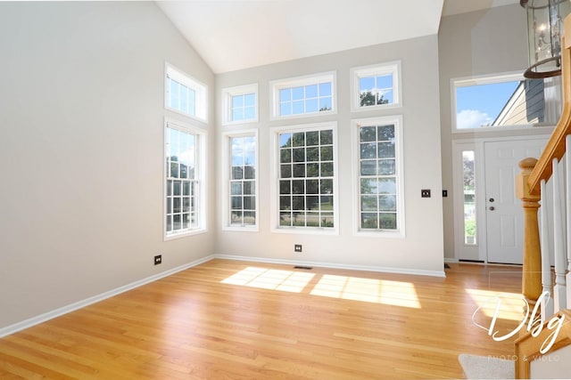 582 Aspen Way, Antioch, IL 60002 - entryway with high vaulted ceiling, plenty of natural light, light wood-style floors, and stairs