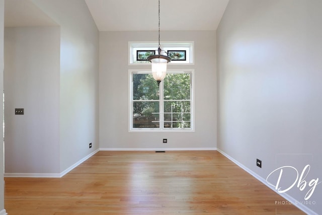 582 Aspen Way, Antioch, IL 60002 - unfurnished dining area featuring light wood-type flooring and vaulted ceiling