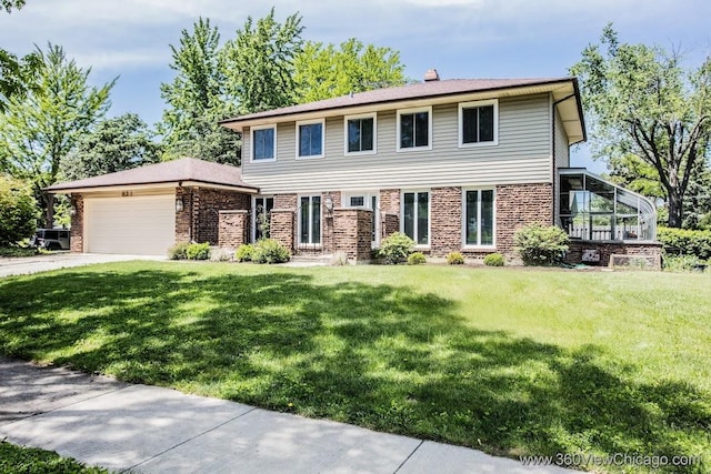 824 62nd St, Downers Grove, IL 60516 - view of front facade featuring concrete driveway, a front yard, brick siding, and an attached garage