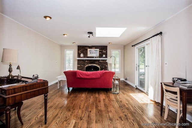 824 62nd St, Downers Grove, IL 60516 - living room featuring ornamental molding, wood finished floors, a skylight, and a fireplace