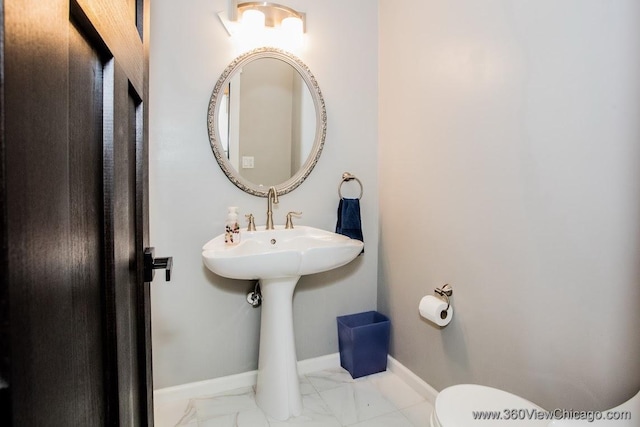 824 62nd St, Downers Grove, IL 60516 - half bathroom featuring marble look tile flooring and toilet