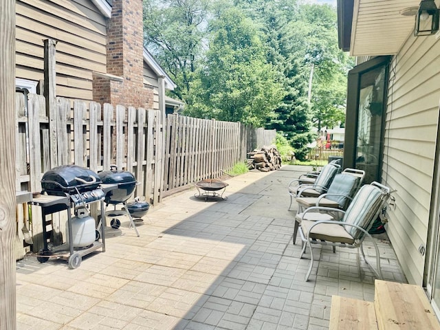 824 62nd St, Downers Grove, IL 60516 - fenced backyard with grilling area, a fire pit, and a patio