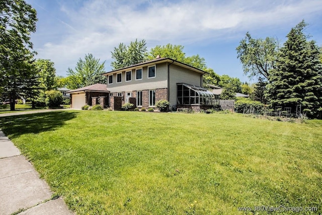 824 62nd St, Downers Grove, IL 60516 - view of front of house with an attached garage, a front lawn, brick siding, and driveway