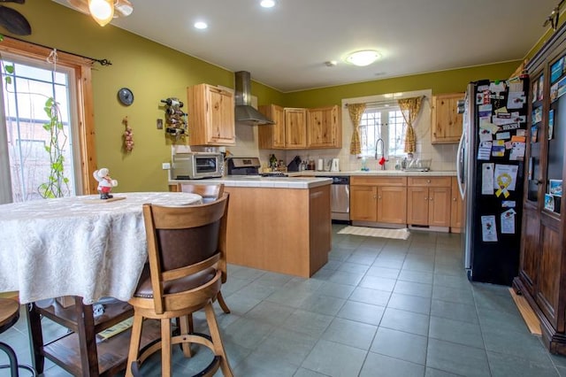 7842 S Blazer Ave, Justice, IL 60458 - kitchen with wall chimney exhaust hood, stainless steel appliances, tasteful backsplash, tile countertops, and recessed lighting