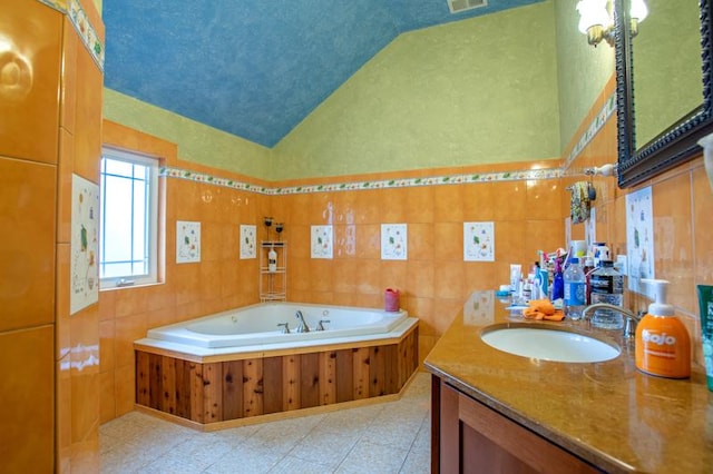 7842 S Blazer Ave, Justice, IL 60458 - bathroom featuring lofted ceiling, vanity, a garden tub, and tile walls