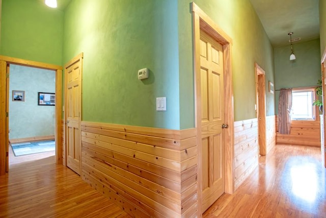 7842 S Blazer Ave, Justice, IL 60458 - corridor featuring wood finished floors, wainscoting, a high ceiling, and wood walls