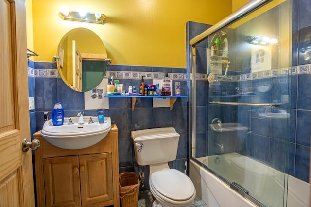 7842 S Blazer Ave, Justice, IL 60458 - full bath featuring vanity, tile walls, shower / bath combination with glass door, and a wainscoted wall