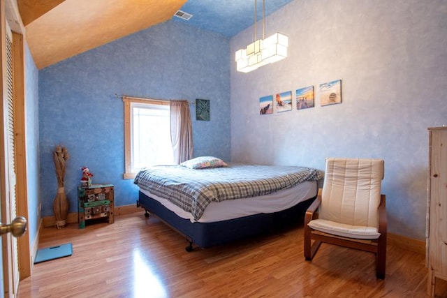 7842 S Blazer Ave, Justice, IL 60458 - bedroom featuring wood finished floors and high vaulted ceiling