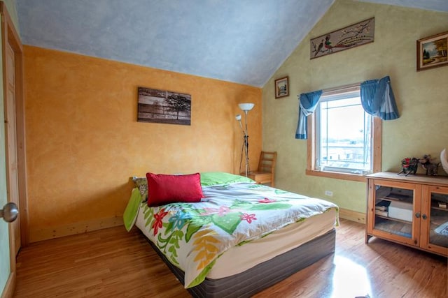7842 S Blazer Ave, Justice, IL 60458 - bedroom with wood finished floors and lofted ceiling