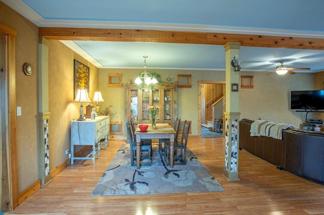7842 S Blazer Ave, Justice, IL 60458 - dining area with light wood-type flooring, a chandelier, a ceiling fan, ornamental molding, and stairway