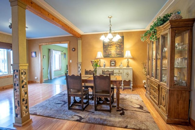 7842 S Blazer Ave, Justice, IL 60458 - dining space featuring light wood-style flooring, a chandelier, and crown molding