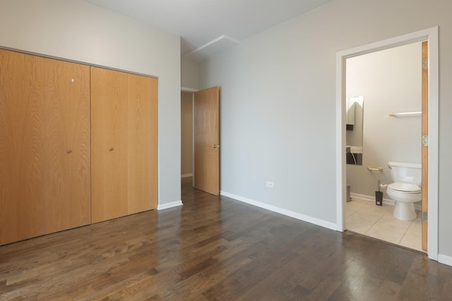719 W 31st St Unit 2, Chicago, IL 60616 - unfurnished bedroom featuring a closet, wood finished floors, and connected bathroom
