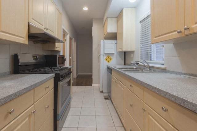 719 W 31st St Unit 2, Chicago, IL 60616 - kitchen with stainless steel appliances, under cabinet range hood, tasteful backsplash, light tile patterned floors, and recessed lighting