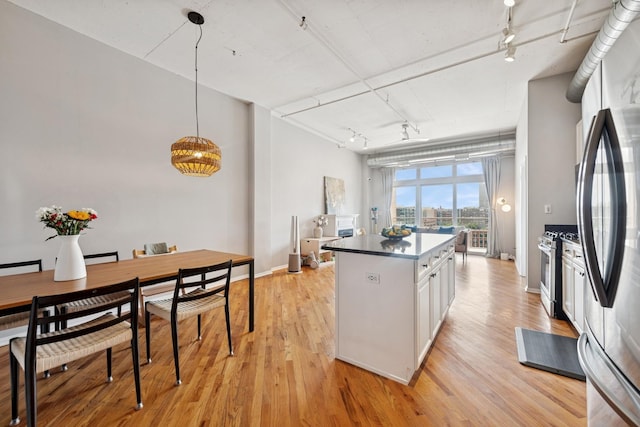 950 W Monroe St Unit 808, Chicago, IL 60607 - kitchen with track lighting, stainless steel appliances, white cabinets, and light wood-type flooring