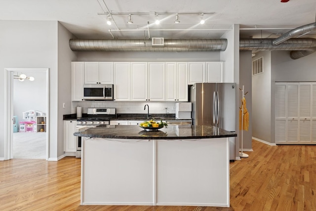950 W Monroe St Unit 808, Chicago, IL 60607 - kitchen with appliances with stainless steel finishes, track lighting, and white cabinetry