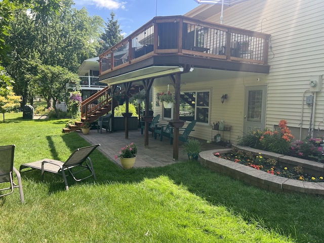 980 Hillcrest Blvd, Hoffman Estates, IL 60169 - rear view of house with a lawn, stairs, a wooden deck, and a patio area