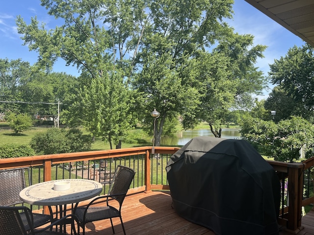 980 Hillcrest Blvd, Hoffman Estates, IL 60169 - wooden deck with area for grilling, outdoor dining area, and a water view