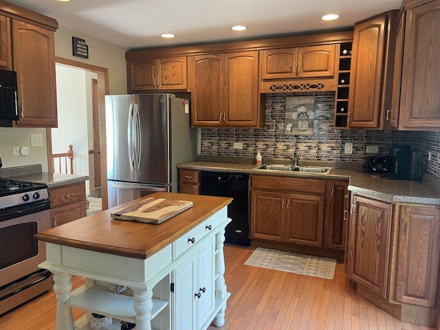 980 Hillcrest Blvd, Hoffman Estates, IL 60169 - kitchen featuring open shelves, black appliances, wood counters, light wood finished floors, and tasteful backsplash