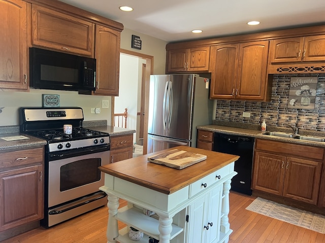 980 Hillcrest Blvd, Hoffman Estates, IL 60169 - kitchen featuring black appliances, open shelves, butcher block countertops, light wood-style floors, and decorative backsplash