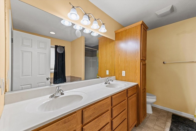 402 Wesley Ave, Savoy, IL 61874 - bathroom with double vanity and a shower