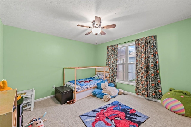 402 Wesley Ave, Savoy, IL 61874 - carpeted bedroom featuring a ceiling fan and a textured ceiling