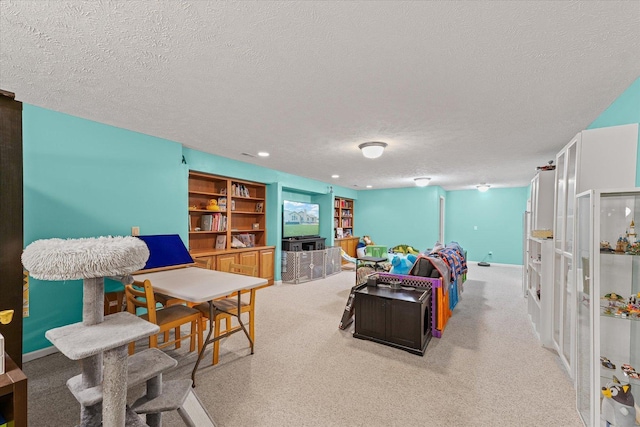 402 Wesley Ave, Savoy, IL 61874 - carpeted living room featuring a textured ceiling and built in features