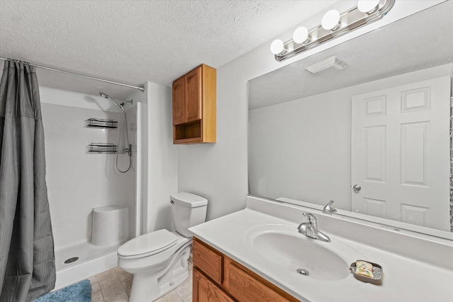 402 Wesley Ave, Savoy, IL 61874 - full bathroom with vanity, a shower stall, a textured ceiling, and tile patterned floors