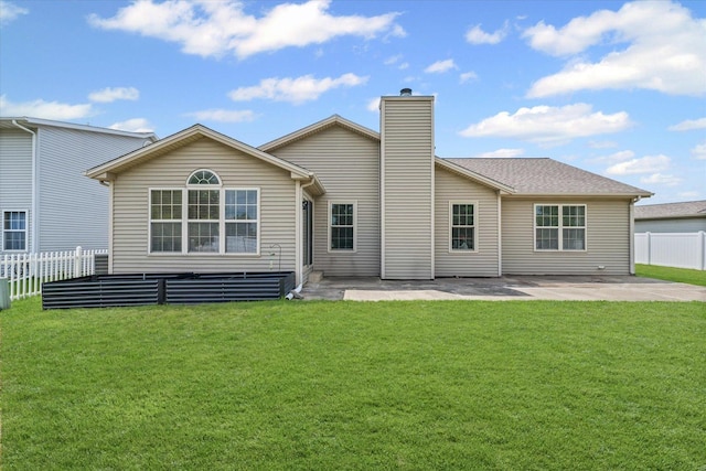 402 Wesley Ave, Savoy, IL 61874 - rear view of property featuring a patio and a chimney