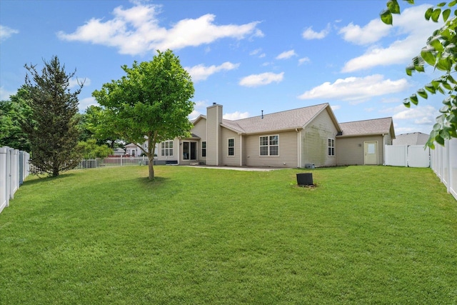402 Wesley Ave, Savoy, IL 61874 - back of property with a fenced backyard and a patio