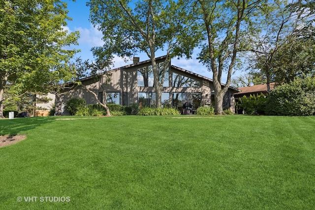 3118 River Falls Dr, Northbrook, IL 60062 - view of front of home featuring a chimney and a front yard
