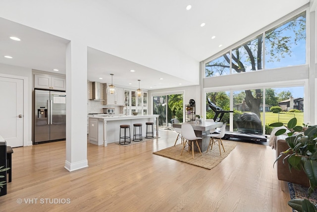 3118 River Falls Dr, Northbrook, IL 60062 - dining space with recessed lighting, light wood-type flooring, and a towering ceiling