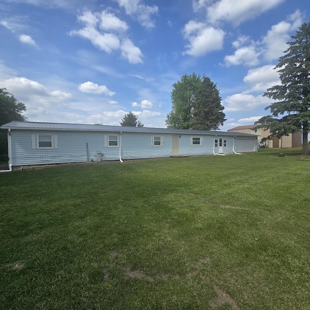 16306 W Canada Rd, Polo, IL 61064 - rear view of property featuring a yard, a metal roof, and a standing seam roof