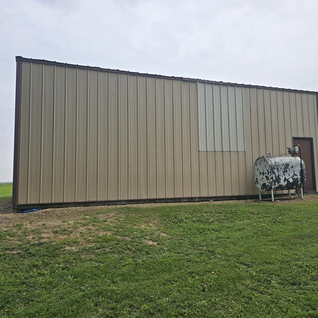 16306 W Canada Rd, Polo, IL 61064 - view of grassy yard with oil tank, a pole building, and an outbuilding