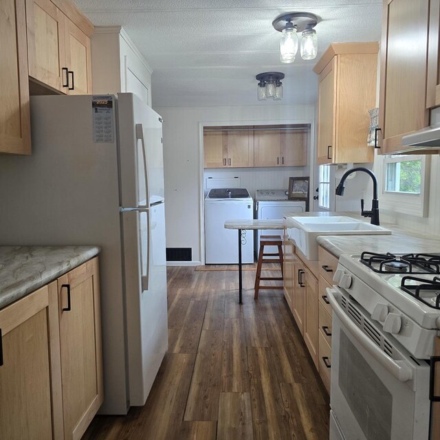16306 W Canada Rd, Polo, IL 61064 - kitchen featuring separate washer and dryer, white appliances, light brown cabinets, dark wood finished floors, and a textured ceiling