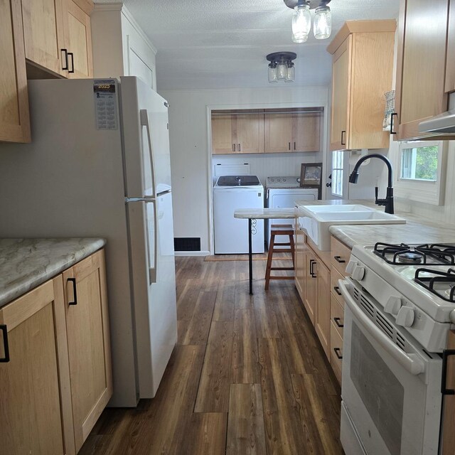 16306 W Canada Rd, Polo, IL 61064 - kitchen featuring washing machine and clothes dryer, white appliances, light brown cabinetry, and dark wood-style flooring