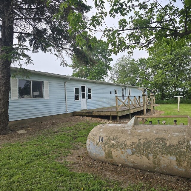 16306 W Canada Rd, Polo, IL 61064 - back of property featuring a wooden deck and a lawn