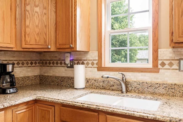 10873 Meadowsweet Ln, Roscoe, IL 61073 - kitchen with light stone counters and decorative backsplash